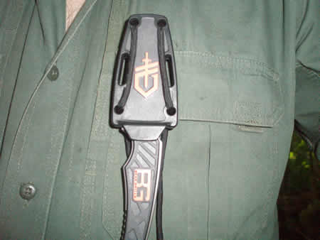 Sheath securely attached to clothing